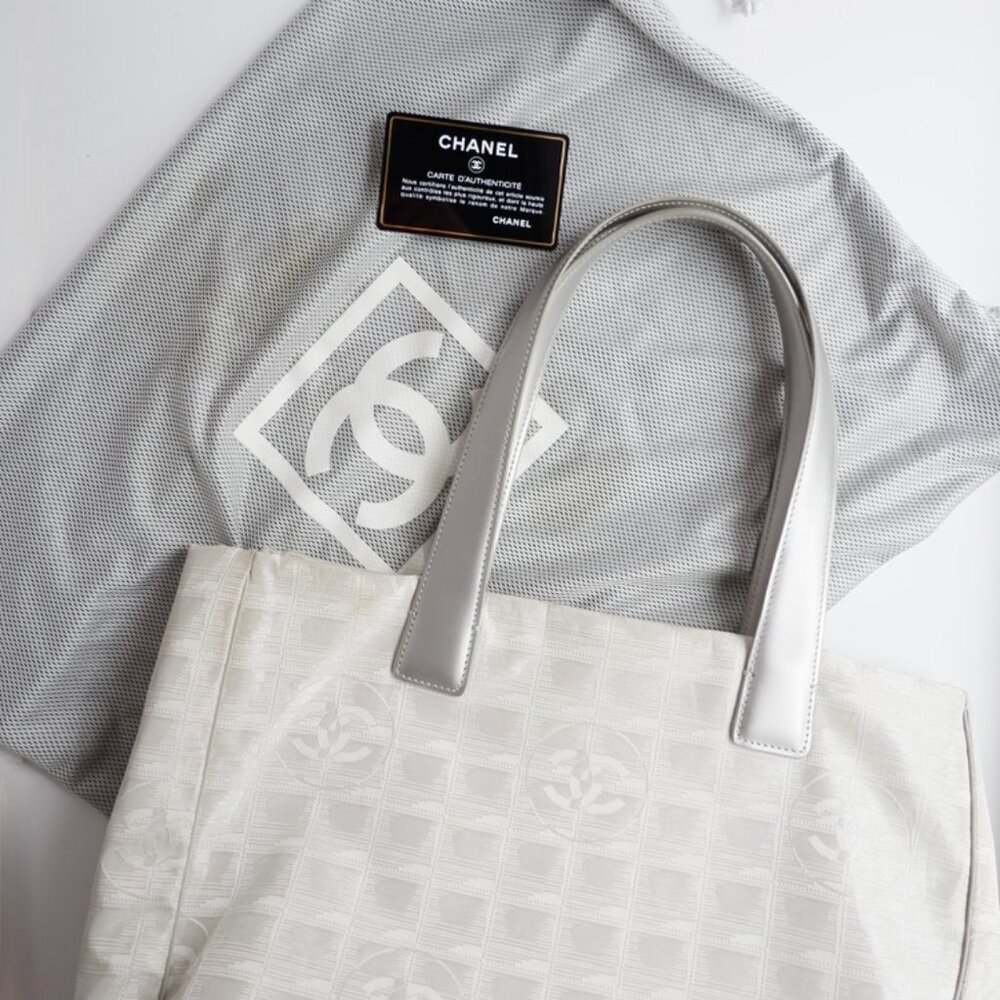 Authentic Preowned Chanel Silver Canvas New Travel Line Tote Bag